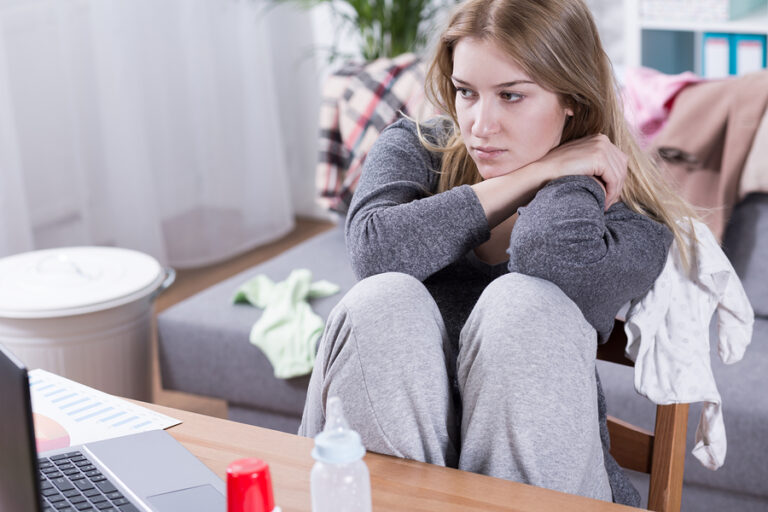A woman suffering from postpartum depression and alcohol addiction.