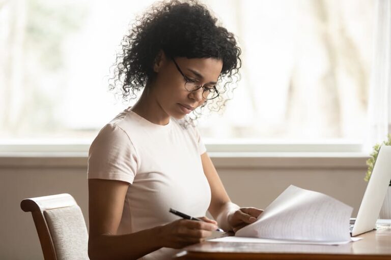 A woman working on financial planning for addiction rehab.
