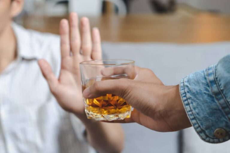 A person refusing to drink alcohol.