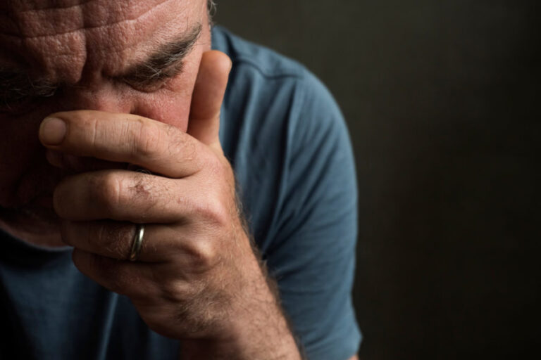 A depressed man dealing with co-occurring grief and an alcohol addiction.