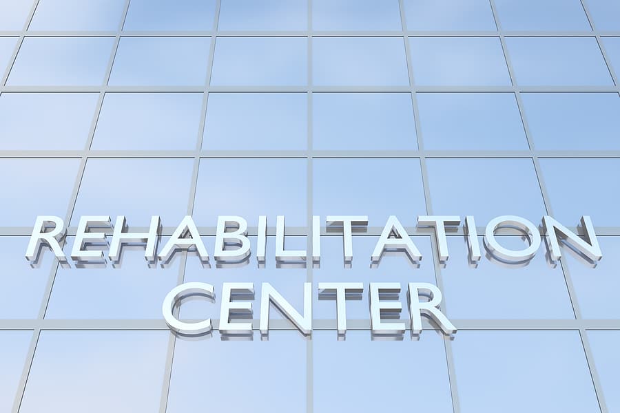 The words rehabilitation center on a building