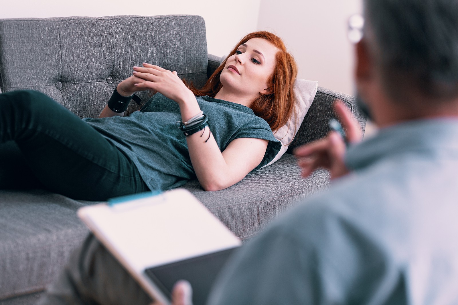 Young woman in therapy speaking to therapist