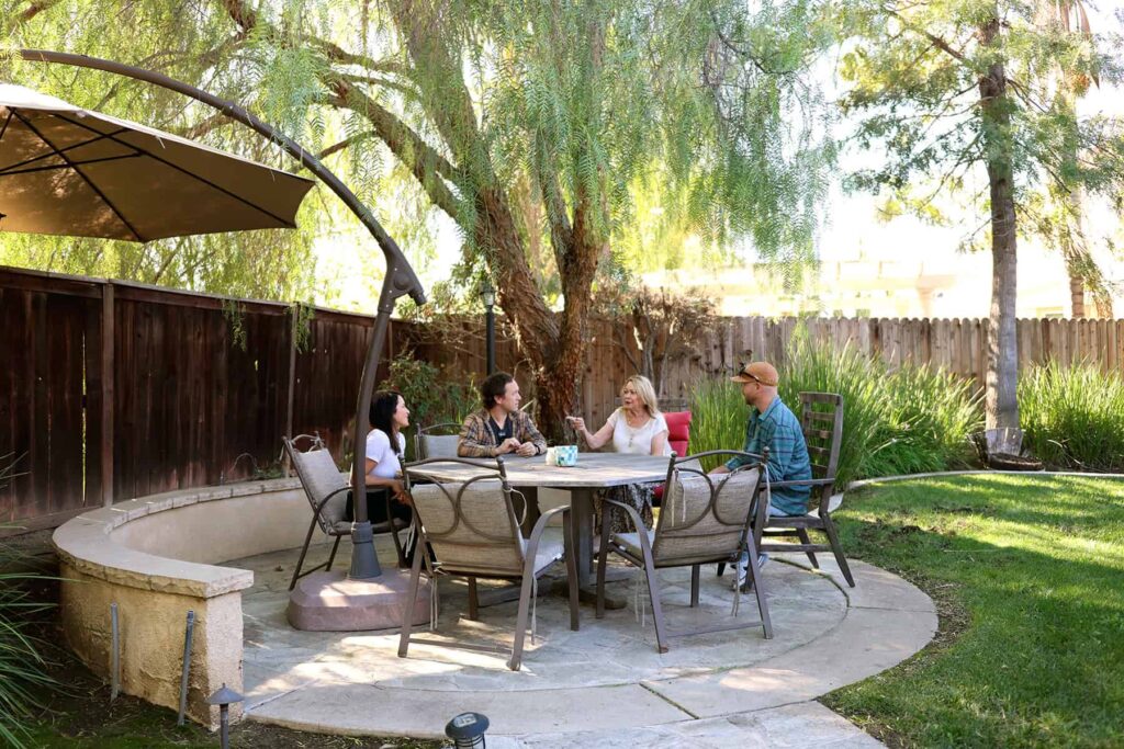 The shaded backyard patio at a Ranch Creek Recovery residence in Murrieta